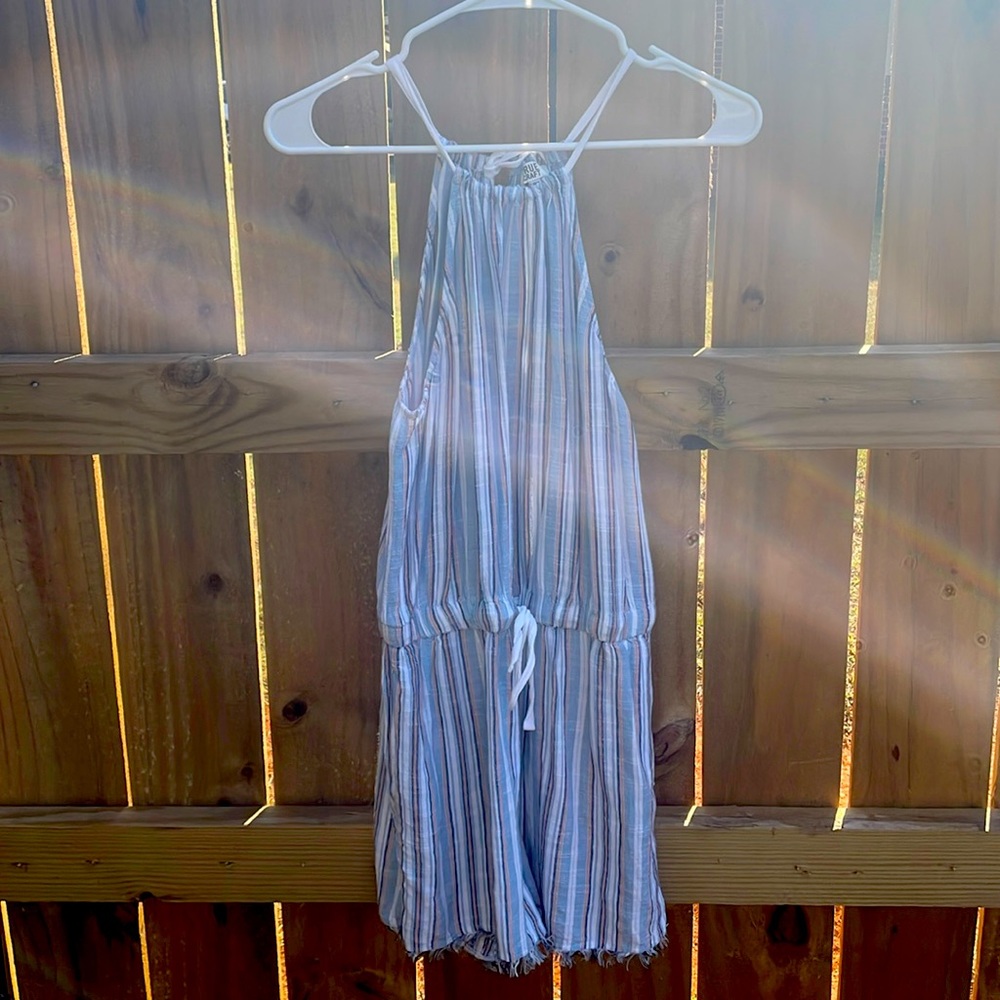 Light blue navy blue light, orange, and white romper.